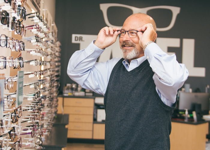 Man trying out eye glasses